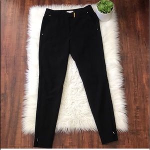 Black skinny pants with golden hardware